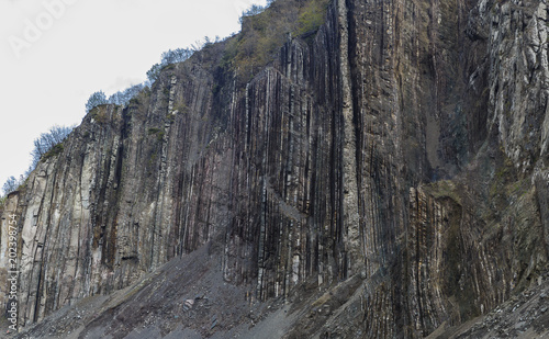 Vertical layers of rock in ...