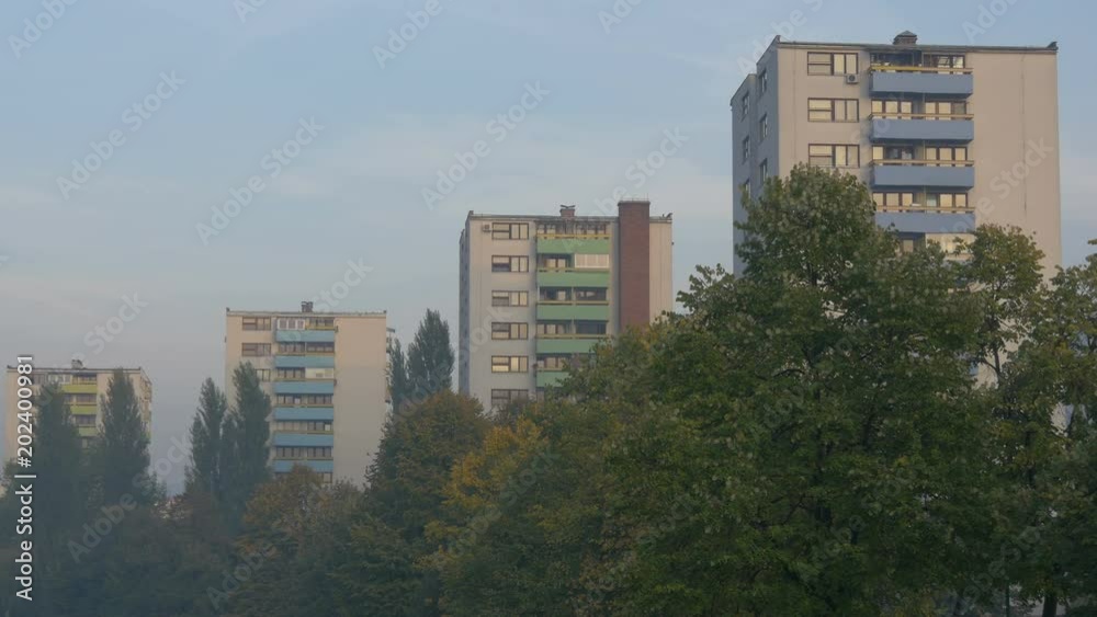 Apartment buildings behind trees Apartment buildings behind trees