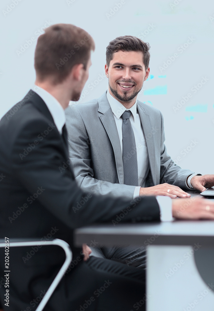 Fototapeta premium Manager with the colleague sitting at the Desk