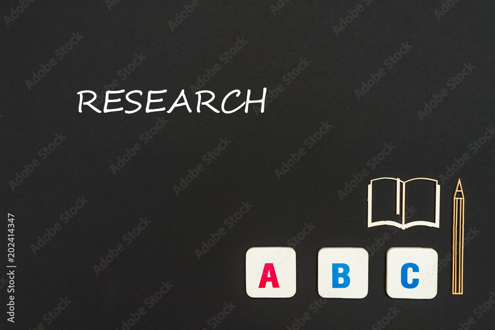 abc letters and chipboard miniature on blackboard with text research abc letters and chipboard miniature on blackboard with text research
