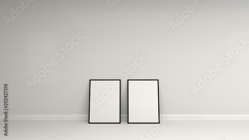 Blank white poster in black frame standing on the floor