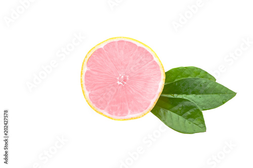 Half of a fresh, clean, glowing pink lemon with green leaves on a white background. isolated.