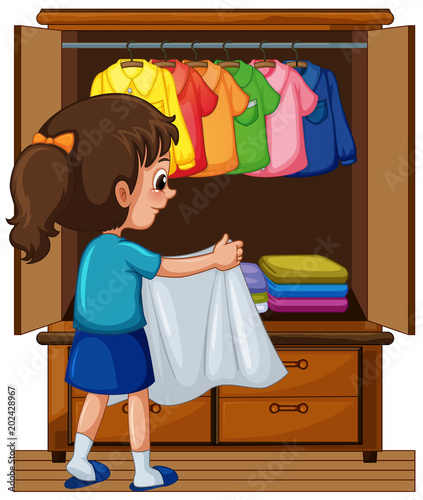 Girl putting away clothes in closet