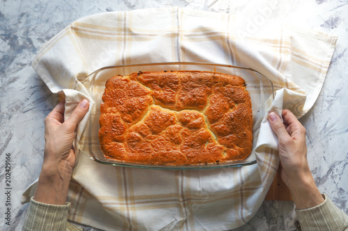 Cake with cabbage in the form of for baking. Homemade cake. Cabbage casserole. Delicious rustic cuisine.
 photo