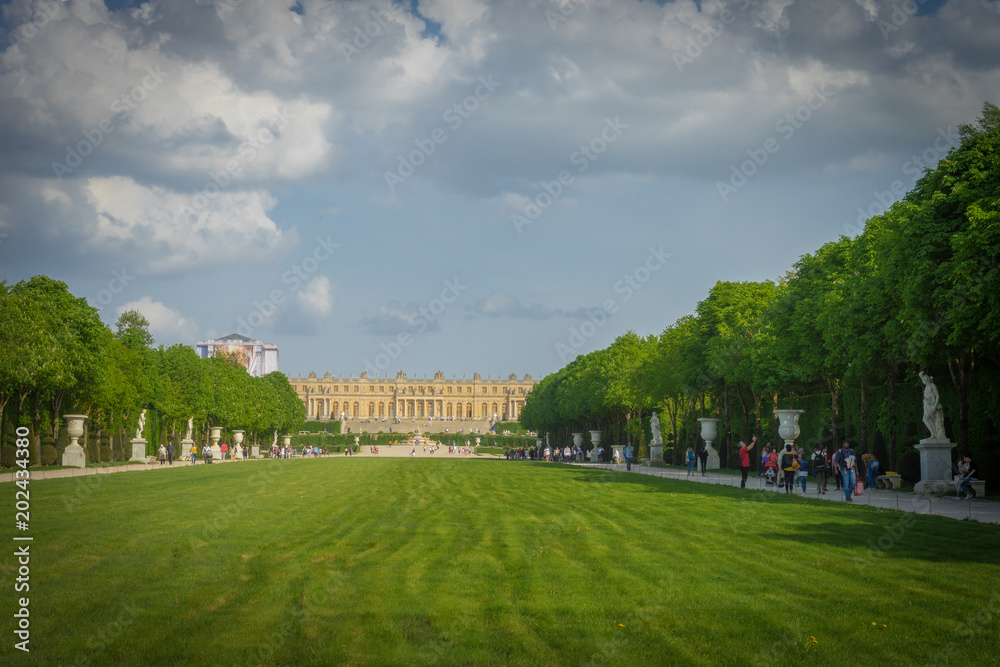 Versailles, France - 04 22 2018: Château de Versailles et son parc, ses bosquets et bassins. Tapis vert