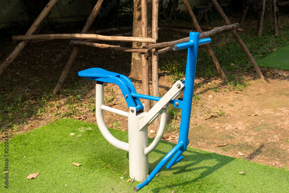 Outdoors public excercise machine in a public park. Outdoors public excercise machine in a public park.