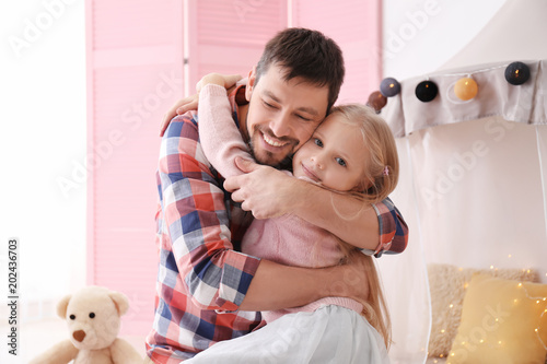 Cute little girl and her fa...