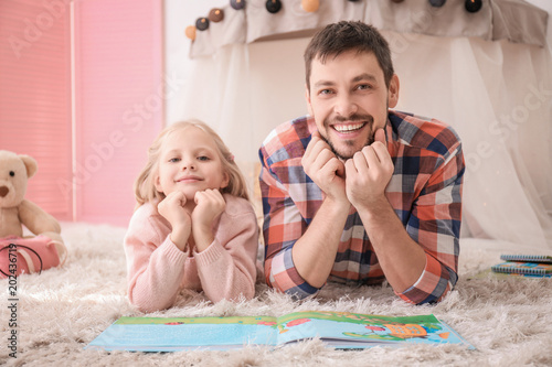 Cute little girl and her fa...