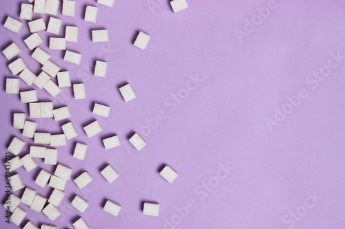  sugar cubes on a pastel background with space for text. top view, minimalism, design. diabetes, diet, sweets 