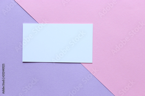 a business card on a pastel background and plenty of space for text insertion. minimalism, top, design 