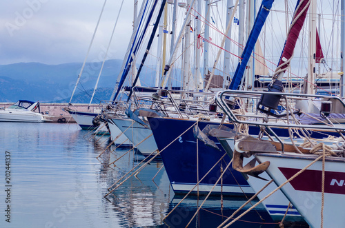 Agios Nikolaos Crete, - view of luxurious yachts tied up at the dock of marine of cosmopolitan city of Agios Nikolaos.