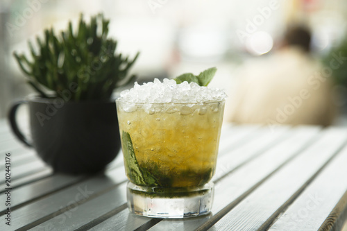 Classic mint julep cocktail, outdoors photo