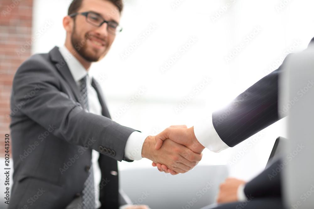 Close up of business handshake in the office