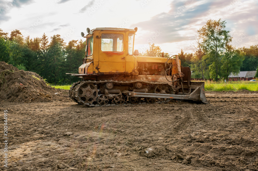 The excavator cleared the land leaving traces . Selective focus. Copy space. A horizontal frame The excavator cleared the land leaving traces . Selective focus. Copy space. A horizontal frame