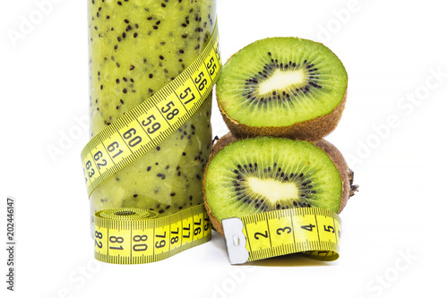 kiwis, tape measure, kiwi smoothie. Diet and food concept