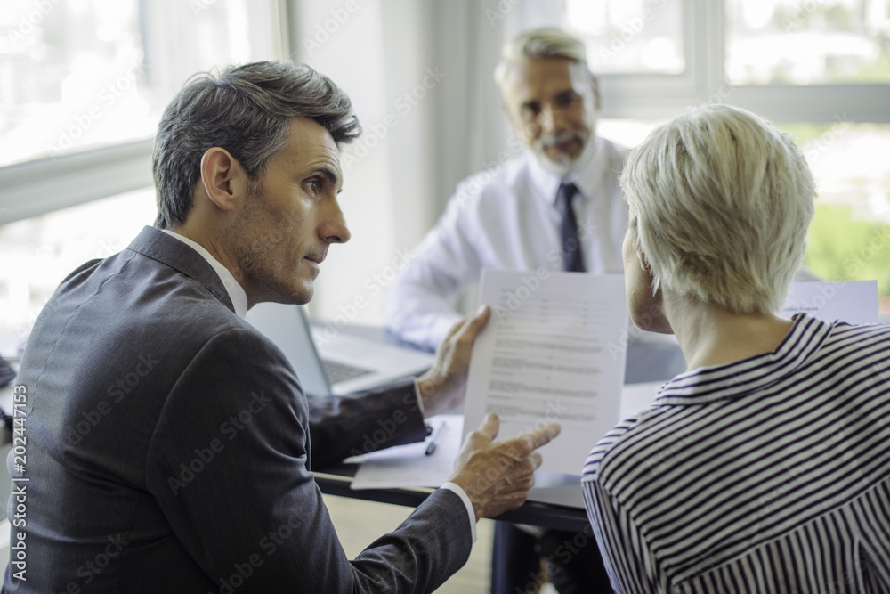 Businessman meeting with couple Businessman meeting with couple