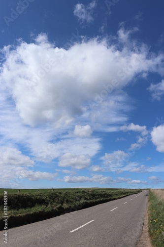 Clouds over open road