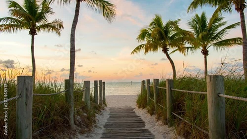 Footbridge to the Smathers beach on sunrise - Key West, Florida. Raw video source.