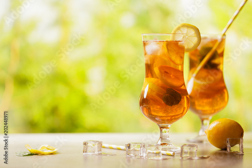 Iced tea with lemon and ice cubes