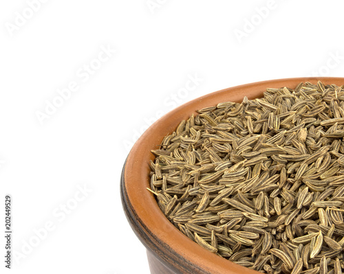 Cumin seeds or caraway isolated on white background photo