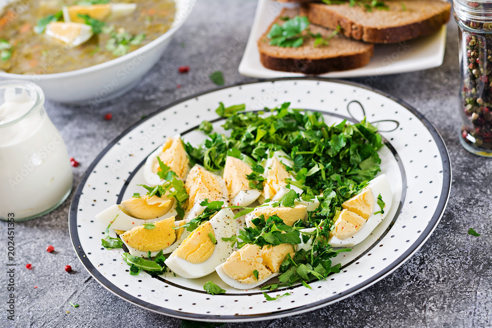 Boiled eggs with greens. Healthy food. Summer salad Boiled eggs with greens. Healthy food. Summer salad