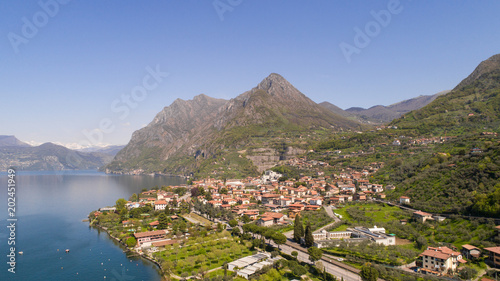 Holidays on lake of Iseo, village of Sale Marasino. Aerial shot with drone