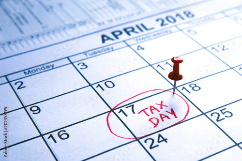 Pin on the date.April monthly calendar with the 17th circled with the words "Tax Day" written in the circle in red colour