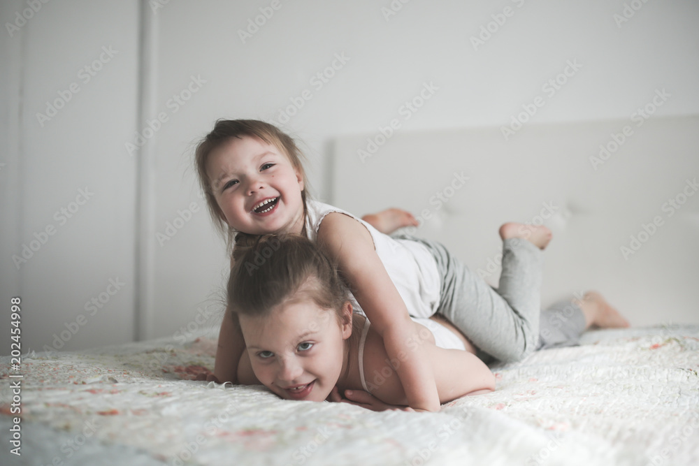 Sister girls play hug, emotions childhood relation Sister girls play hug, emotions childhood relation