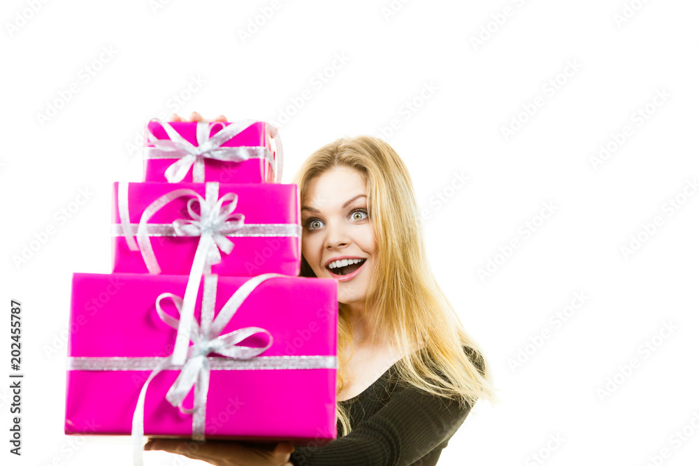 Shocked woman holding gifts Shocked woman holding gifts