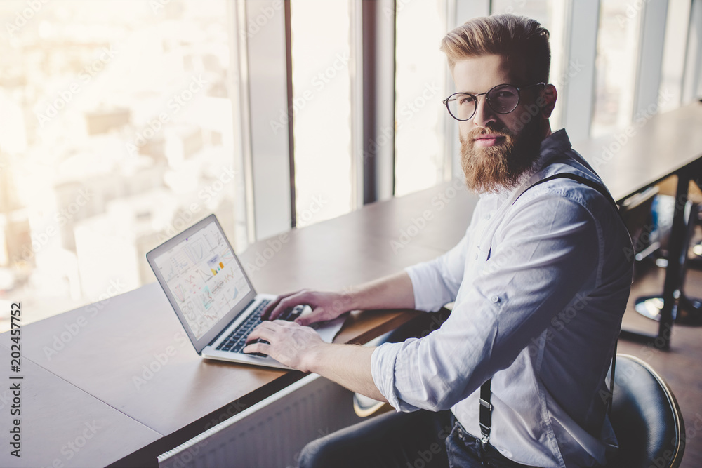 Young man is working in modern office Young man is working in modern office