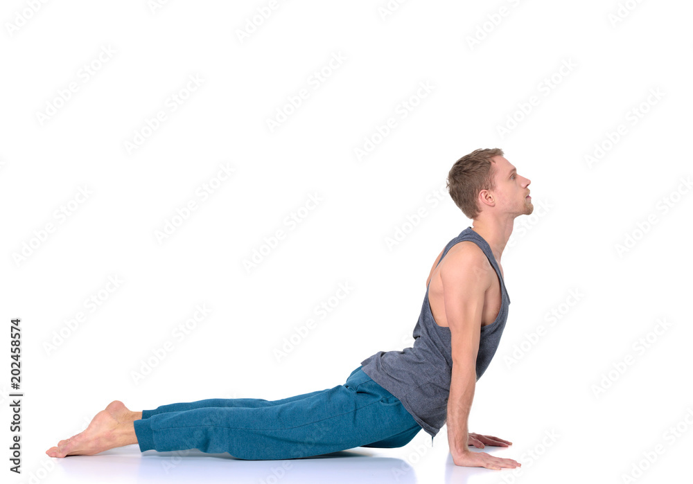 Adult man doing yoga exercise on white background Adult man doing yoga exercise on white background