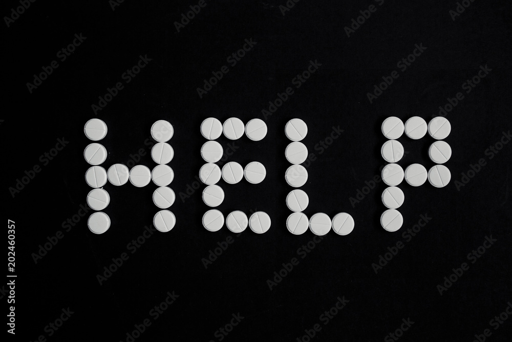 pills on a black background