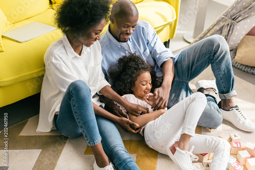 cheerful african american playing together at home