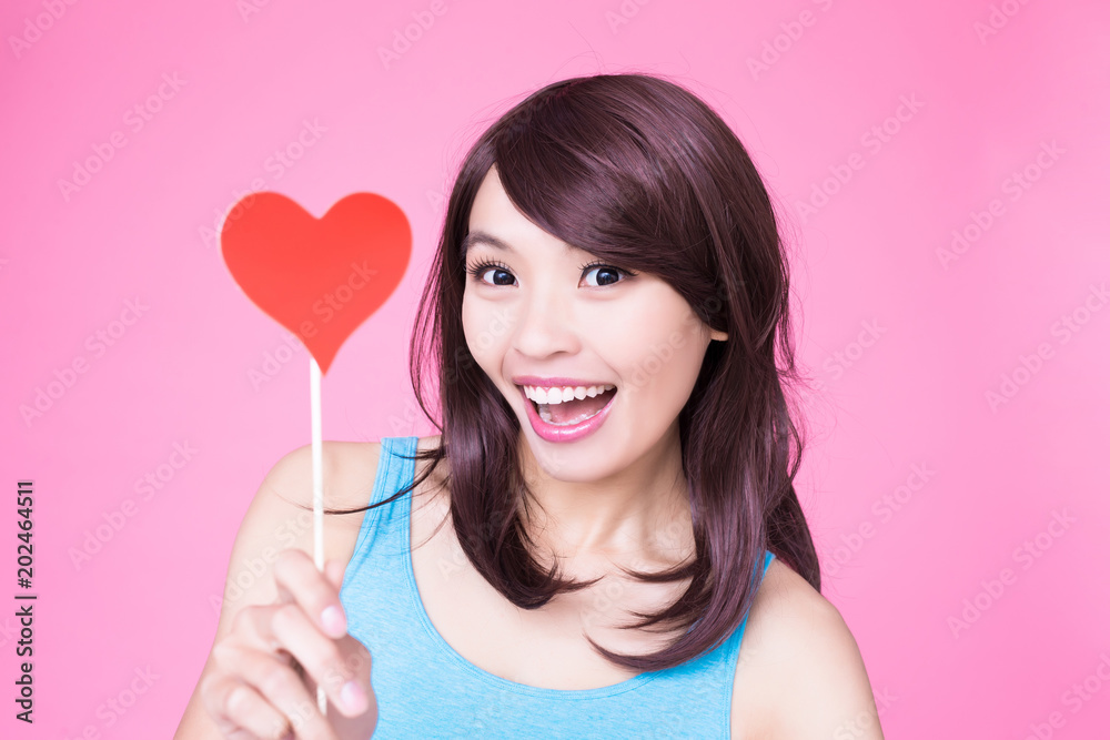 woman holding red love heart woman holding red love heart