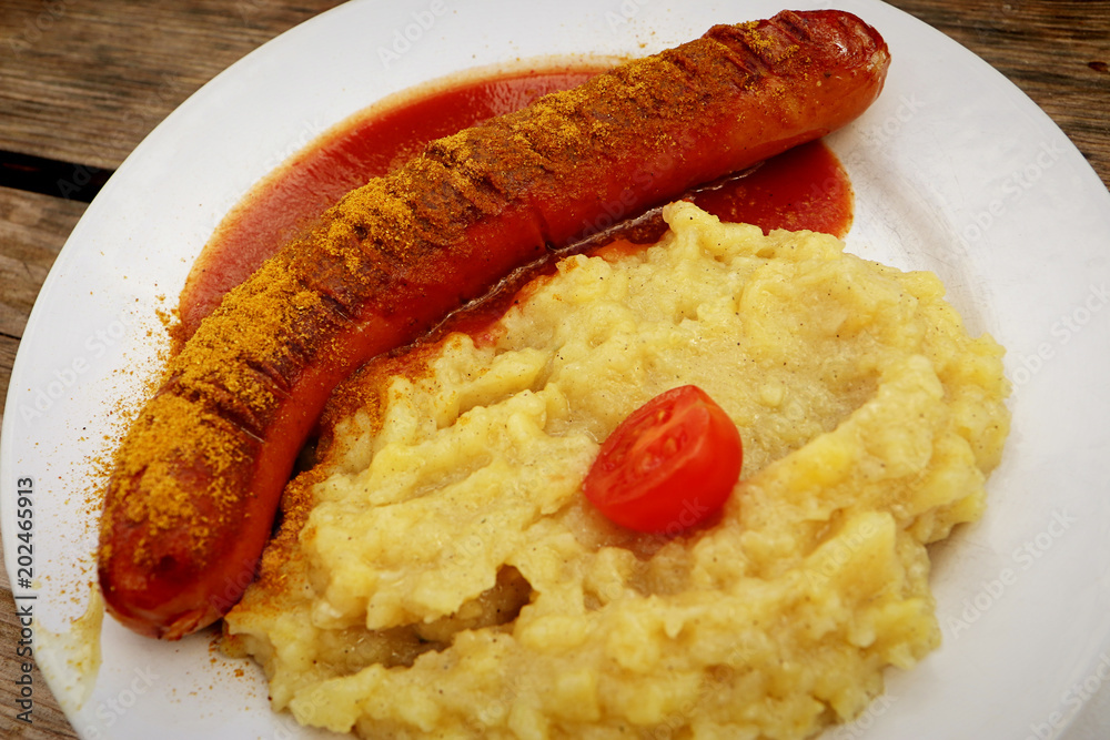 Typical beer garden food in Bavaria curry wurst (sausage with tomato
