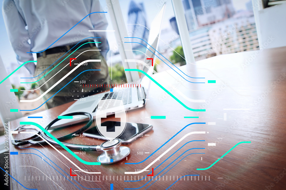 Doctor working with laptop computer in medical workspace office and medical network media diagram as concept Doctor working with laptop computer in medical workspace office and medical network media diagram as concept