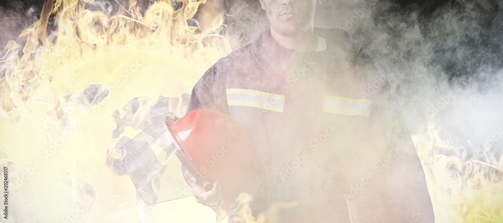 Composite image of serious fireman