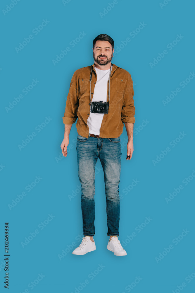 top view of stylish male photographer with camera isolated on blue background top view of stylish male photographer with camera isolated on blue background