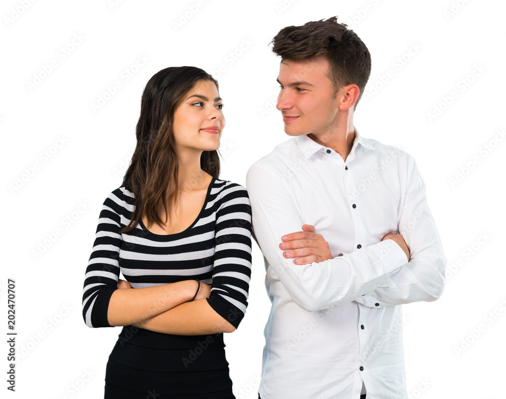 Young couple keeping arms crossed on isolated white background