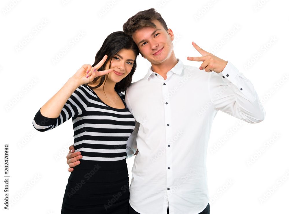 Young couple smiling and showing victory sign on isolated white background Young couple smiling and showing victory sign on isolated white background
