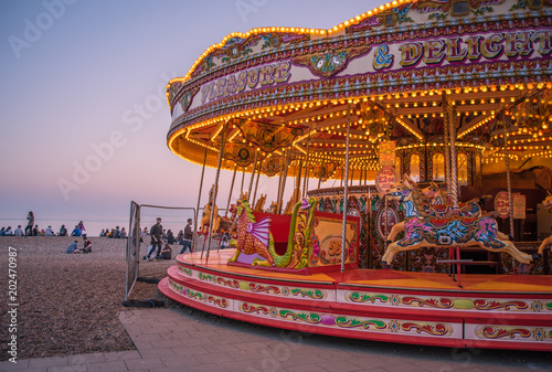 Carousel on Brighton beach at sunset.