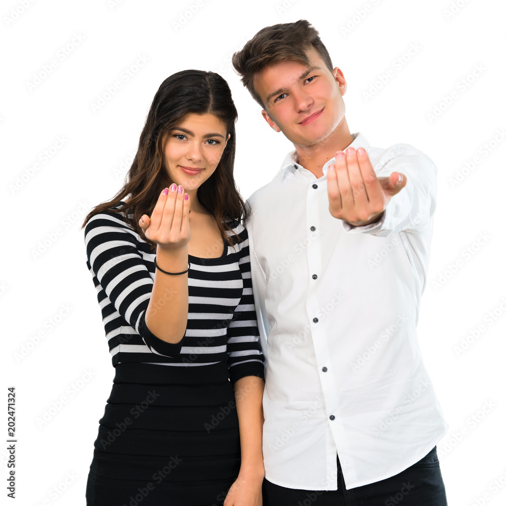 Young couplepresenting and inviting to come on isolated white background Young couplepresenting and inviting to come on isolated white background