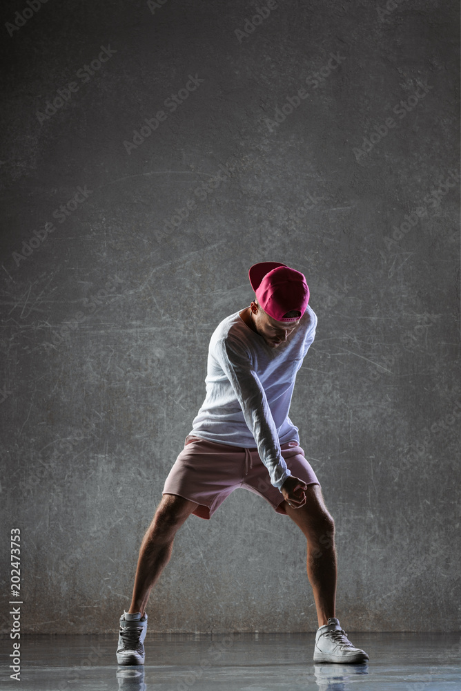 Young beautiful male dancer posing in studio Young beautiful male dancer posing in studio