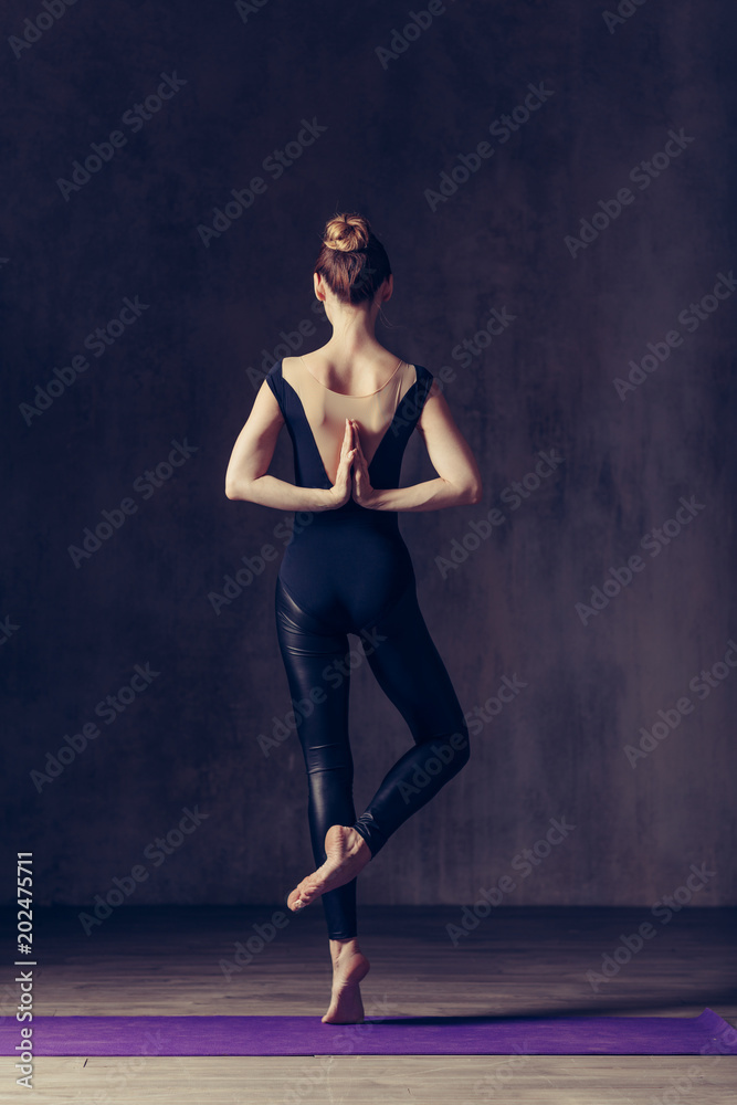 Young beautiful athlete is posing in studio Young beautiful athlete is posing in studio