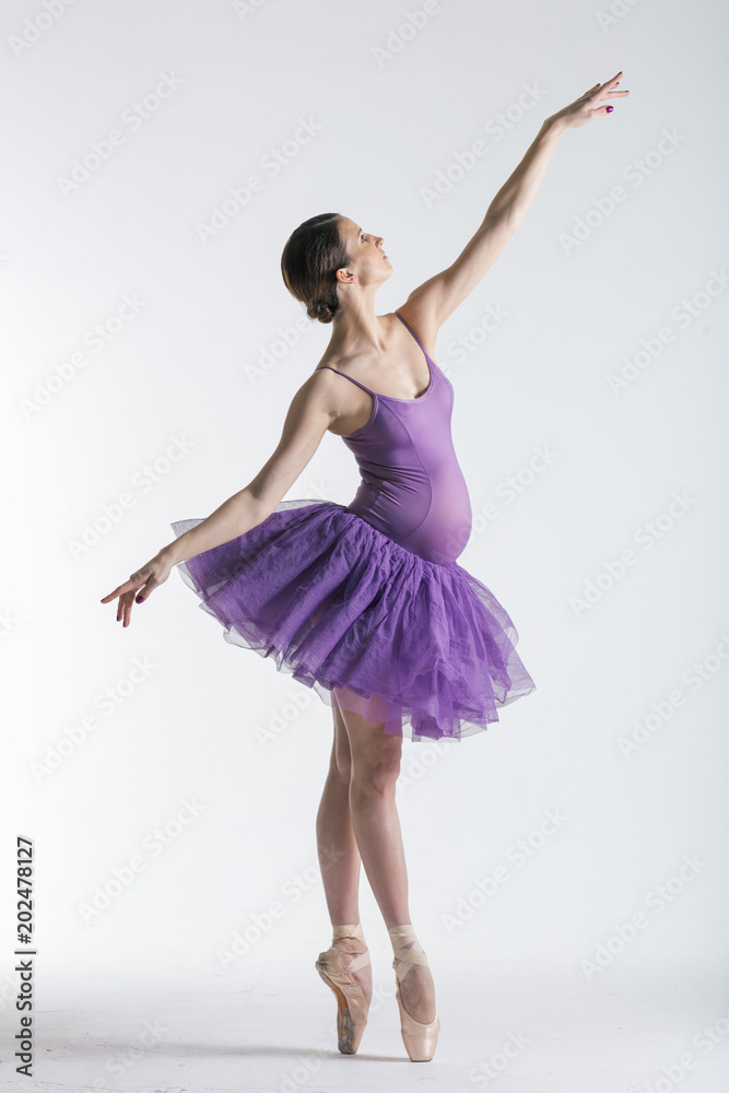 Young beautiful ballerina is posing in studio Young beautiful ballerina is posing in studio