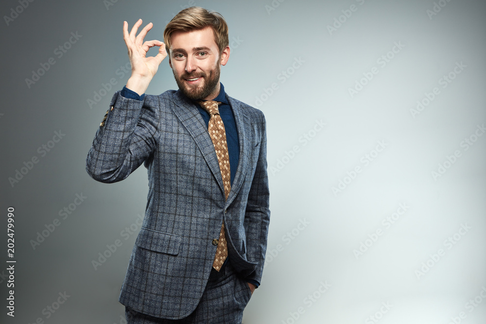 A man in a business suit with different emotions.