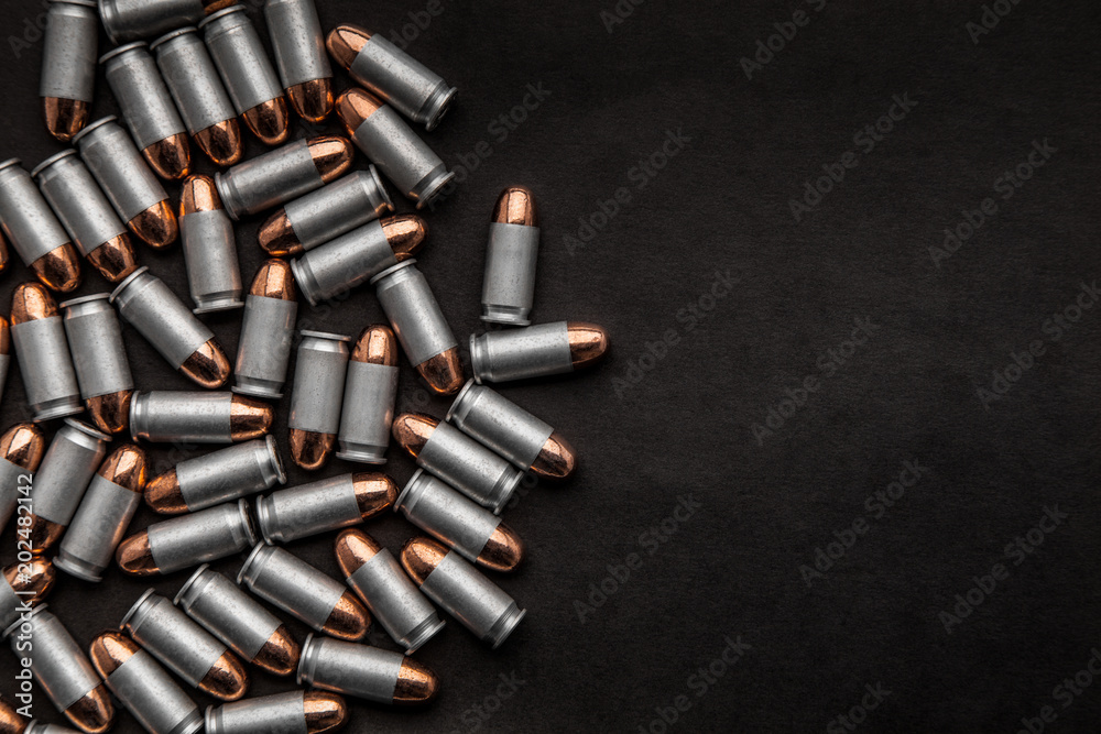 cartridges for a pistol on a black. Flat lay copyspace. cartridges for a pistol on a black. Flat lay copyspace.