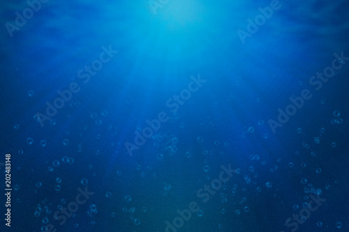 underwater background with bubbles and rays of lights effect that can be used for artworks or advertisements