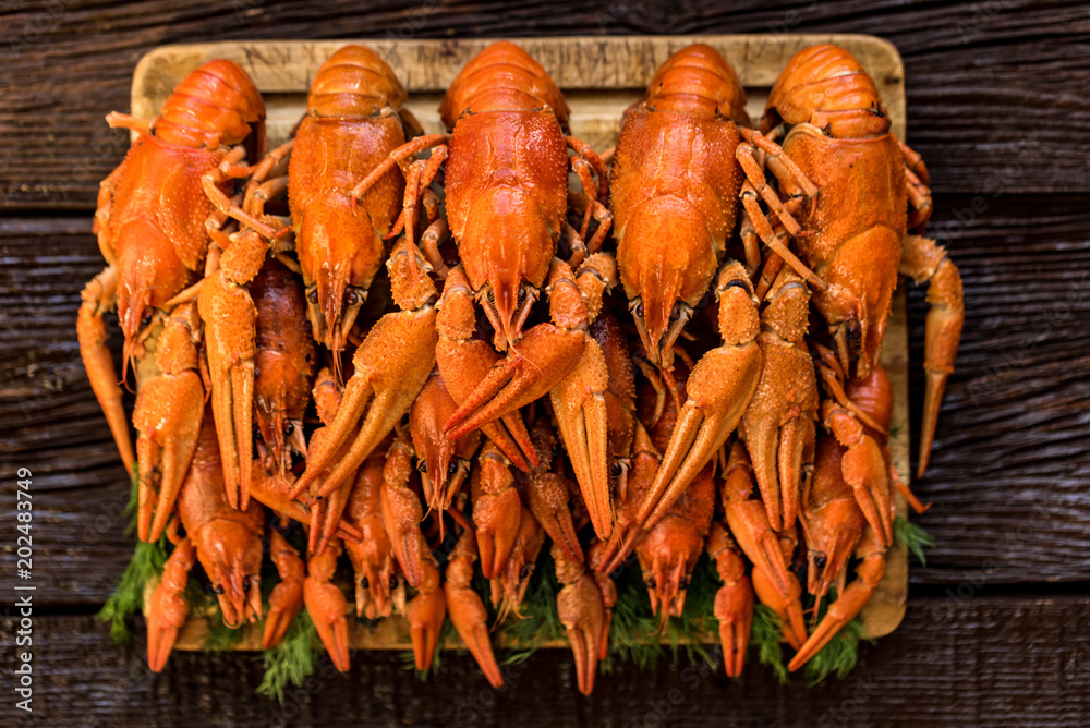 Boiled crayfish on rustic wooden background Boiled crayfish on rustic wooden background