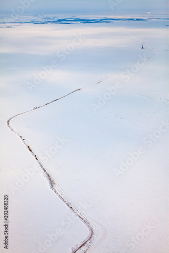 Oil derrick and road in tundra  view from above